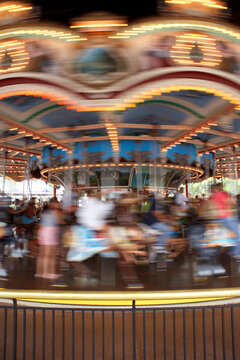 A merry-go-round spinning at an amusement park. (blurred motion)