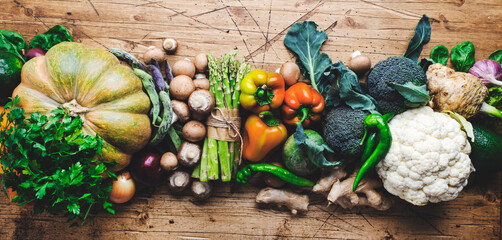 Autumn seasonal food, vegetarian cooking ingredients. Organic vegetables, pumpkin, mushrooms,...