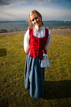 A portrait of a young girl in the traditional clothes of her native TK.