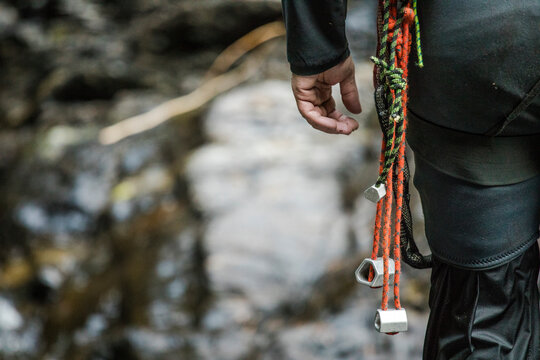 Close up of nuts on climber's belt during a canyoneering trip
