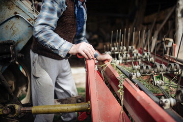 Trailers for agricultural machinery. Old arm closeup.
