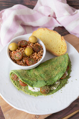 Spinach pancakes with cheese and cherry tomatoes with lentil salad. Ready-to-eat vegetarian food