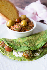 Spinach pancakes with cheese and cherry tomatoes with lentil salad. Ready-to-eat vegetarian food