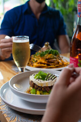 Tuna tartar. Tuna cut into small cubes mixed with soy and spicy and avocado bed

