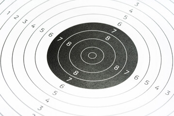 Simple plain circle shape round gun shooting paper target object closeup detail, nobody. Target practice shooting range accessories, aim training, accuracy concept, no people. Gun sports, competitions