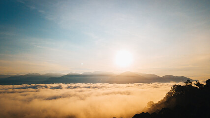 Sea clouds during golden sunrise above the Titiwangsa range mountains in Lenggong, Perak.