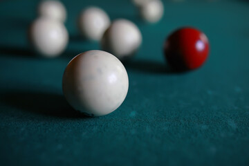 Russian billiard balls, cue, triangle, chalk on a table Green cloth Copy space