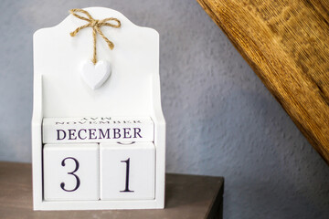 December 31 inscription on white cubes. the design is on the table