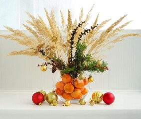 Fir decorations at home winter. New Year concept. Natural spruce bouquet with dry decor and pampas...
