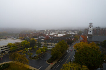 Dark and cold foggy morning in an urban town