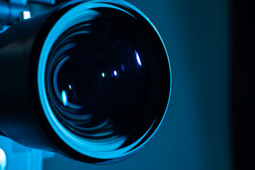 Close-up of a digital camera lens with dark light. Copy space for text.
