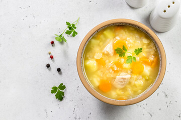 Split pea turkey soup in bowl. Top view, copy space, flat lay.