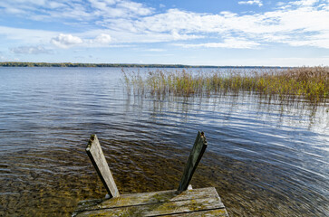 Swedish lake with traditional wooden bridge