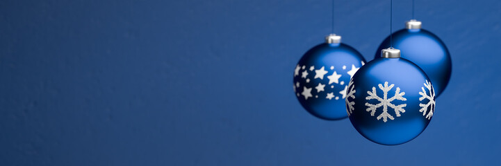 Classic blue christmas baubles with different design hanging in front of classic blue background....