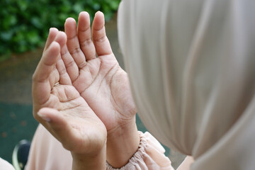 Close up of muslim women hand praying at ramadan 