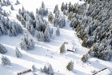 Winter wonderland in ski resort Pamporovo, Bulgaria. Aerial view of snow capped mountains,...