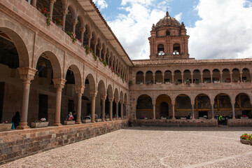 Fototapeta na wymiar Inner courtyard, with a view of the corridors with arches and columns in Qorikancha, Church and Convent of Santo Domingo de Guzmán, in Cusco. 