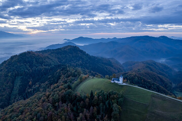 The Church of St. Primož and Felicijan,  Jamnik,  Slovenia, sunset drone photo