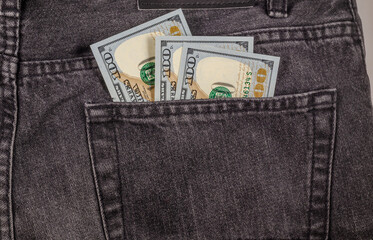 $100 in the back pocket of jeans.