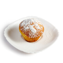 Appetizing sponge cupcake on a plate