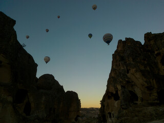 watching the balloons between the rocks and observing the mystical texture of Cappadocia