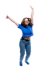 Plus size young girl dancing funny. Happy and positive brunette in jeans and a blue t-shirt....