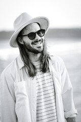 beautiful man in hat on the beach in varna bulgaria, model shooting