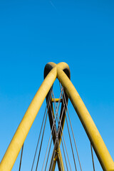 Yellow arches on clear blue sky