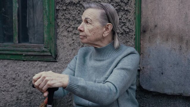 Portrait of senior woman with the cane