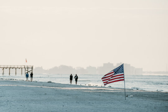 american flag on the beach