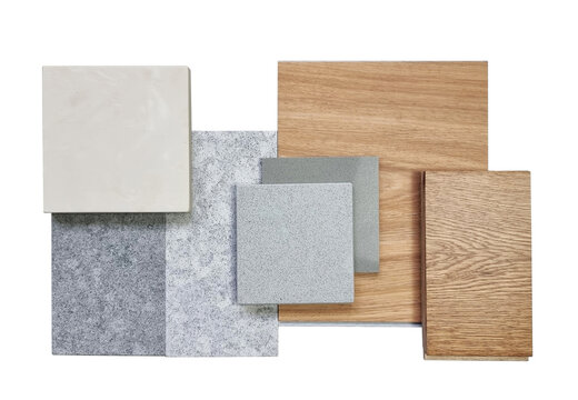 interior material samples including oak engineering flooring, vinyl flooring tile, grey grainy stone tile, cream onyx artificial stone, grey quartzs isolated on background with clipping path.