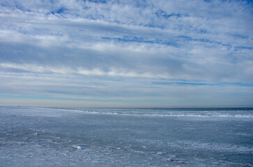 Naklejka na ściany i meble clouds over the frozen sea