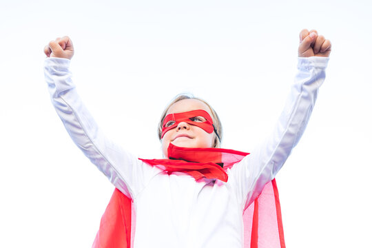 Adorable little girl in superhero outfit