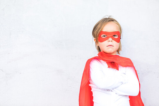 Adorable little girl in superhero outfit