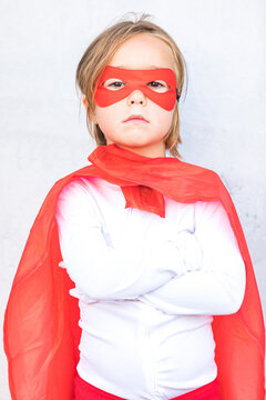 Adorable little girl in superhero outfit