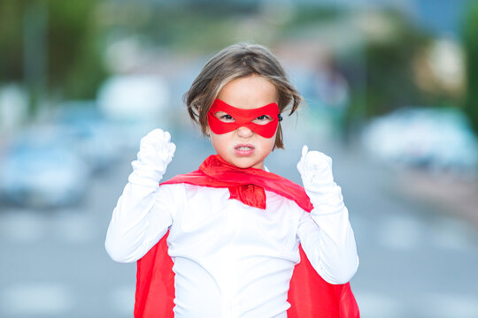 Adorable little girl in superhero outfit