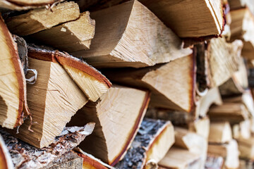 birch split firewood close-up, blurred background