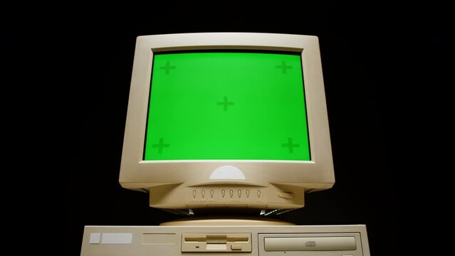 Retro pc with chroma key green screen, Old computer studio close-up, Desktop vintage retro wave display, late 90s PC mock up for 3d motion design and advertising. 