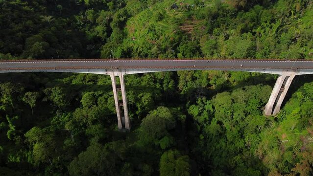 The highest bridge in Southeast Asia is the Tukad Bangkung Bridge. Drone footage from a Bali island in Indonesia