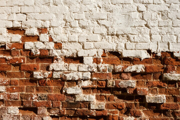 Old painted brick wall with crumbling elements. Uneven textured surface. Design element for...