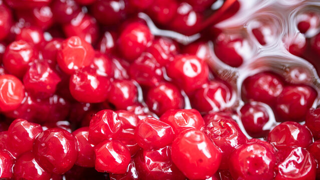Highly detailed, and bright red close up of lingonberry jam. The berries are grown in the wild and usually harvested late summer, early autumn. 