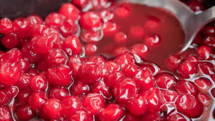 Highly detailed, and bright red close up of lingonberry jam. The berries are grown in the wild and usually harvested late summer, early autumn. 