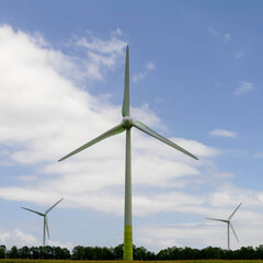 Wind turbines for environmentally friendly energy production on a field in Germany.