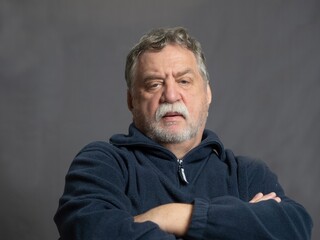 Studio portrait of senior caucasian man with mustaches