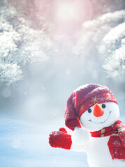 Merry christmas and happy new year greeting card .Happy snowman standing in winter christmas landscape. Snow background - 541066132