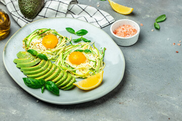 zucchini with eggs and avocado. breakfast. Healthy food, ketogenic diet, diet lunch concept. place for text, top view