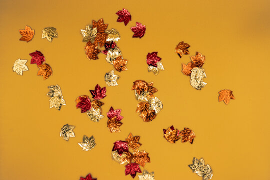Shiny Little Leaves on Yellow Background
