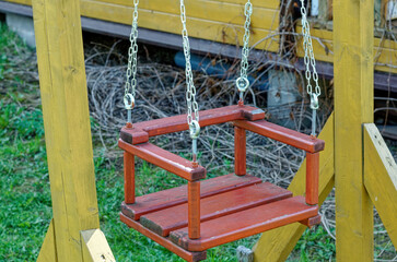 Fototapeta na wymiar old swing in the village