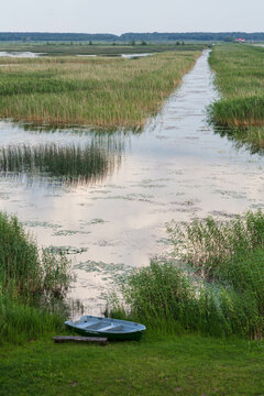 Boat on the shore of Lake Lubans, the biggest lake in Latvia. Shallow drainage lake