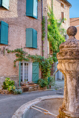 Travel destination, small old village in hear of Provence Cotignac with famous cliffs with cave dwellings and troglodytes houses, Var, Provence Alpes Cote D'Azur, France